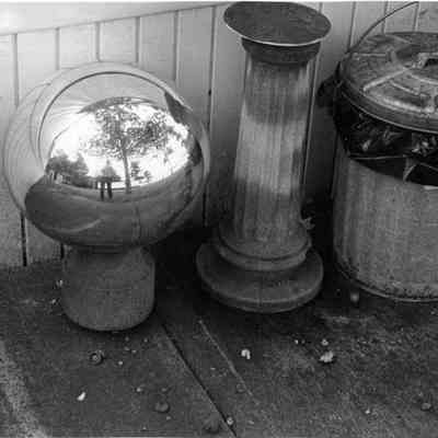 Lawn ornaments and trash cans.