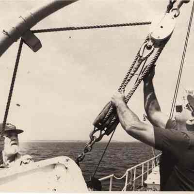 A photo view of two men on board a ship. 5/29/1972