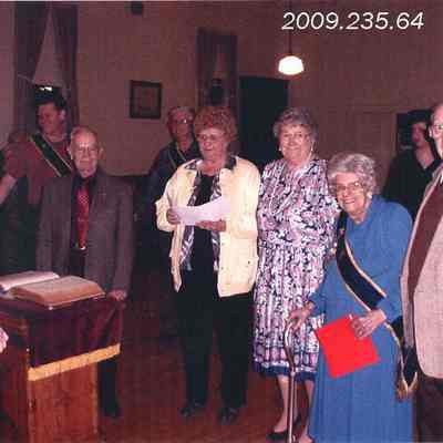 A photo of Leona Gordon wearing a grange sash.