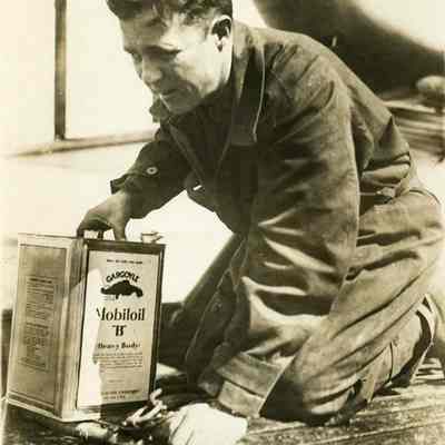 Lt. Harding kneeling aboard the New Orleans