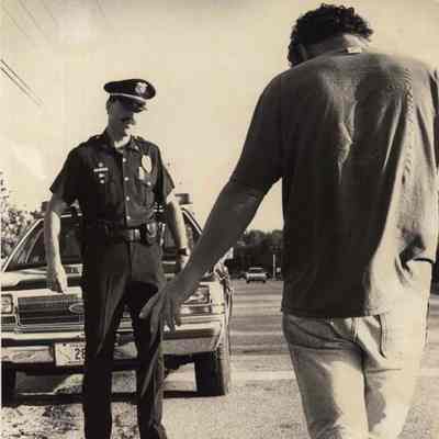 A photo view of a police officer giving an OUI test.. 6/10/1992.