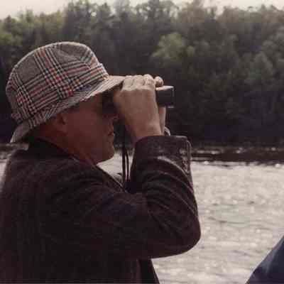 A photo view of a man with field glasses. 9/19/1989.