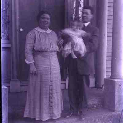 A couple standing in a doorway.