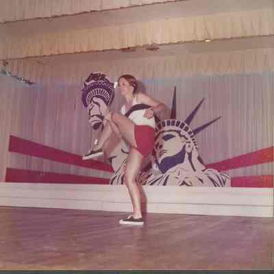 Nancie Prince performing a majorete routine to the tune of "Whipper Cream".