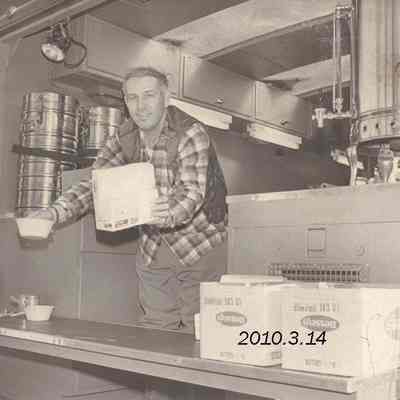 Man Dispensing Coffee and Donuts