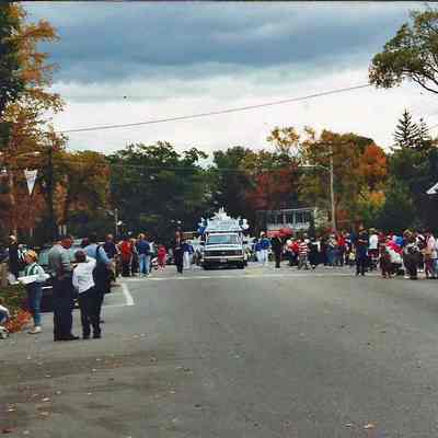 A color photograph of an approaching float near the First Parish Church.