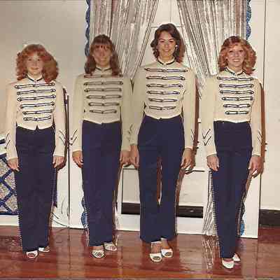 A color photograph of the Teen Queen contestants posing in there costumes.