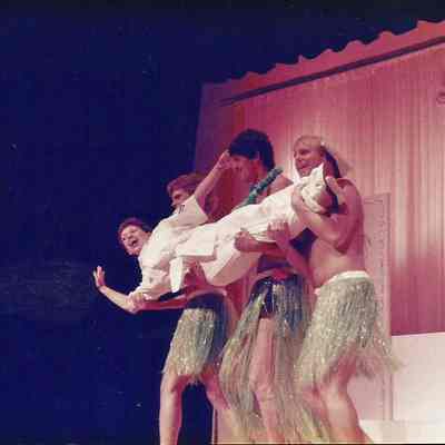 A color photograph of Sharon being carried off .