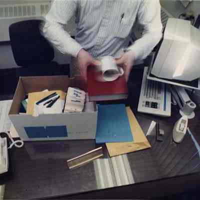 A photo view of John Young unpacking. 3/27/1991.