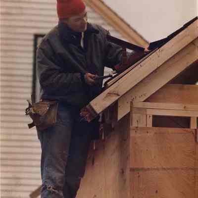 A photo view of a carpenter at work. 1/23/19889.