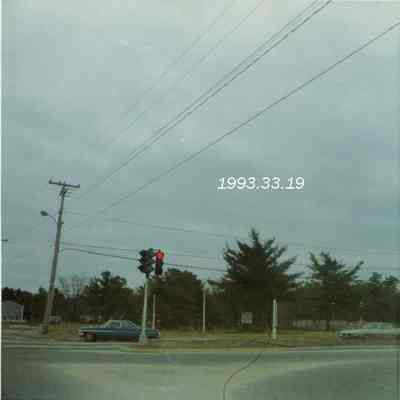 A photo of the traffic light at Cook's Corner. 3/1973.