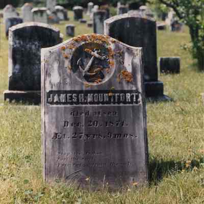 A photo view of a tombstone. 6/29/1990.
