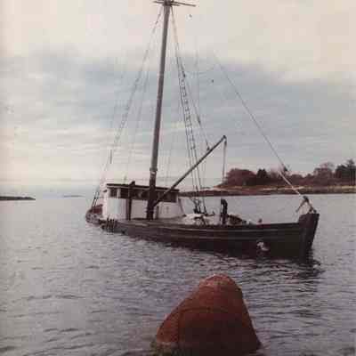 A photo view of a partially submerged ship. 10/20/1989.