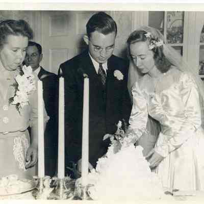 Beverly Brown Cutting Wedding Cake