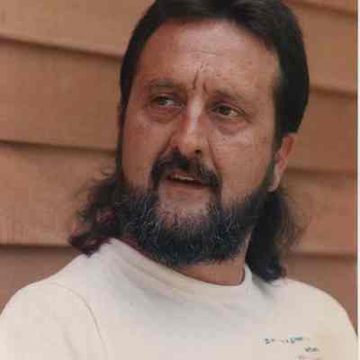 A photo view of a man with a beard. 7/31/1989.