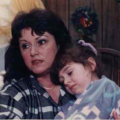 A photo view of a woman and child. 12/18/1989.