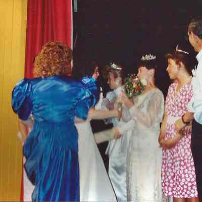 Chressie Gagne and Leanne Roy presenting flowers to Sharon Costedio
