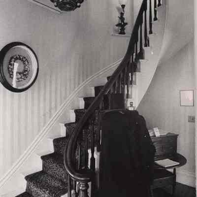 A photo view of a staircase in PHS Museum. 1975.