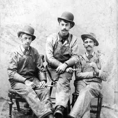 A photo of three men.