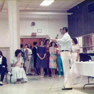 A color photograph of Gene Gagne explaining.