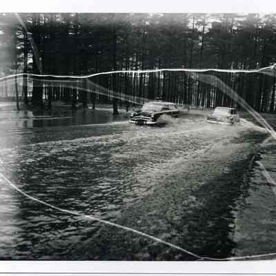 Cars driving through water