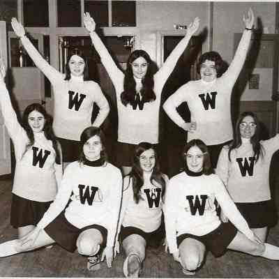 A B/W photograph of a group of cheerleaders for an unknown team.