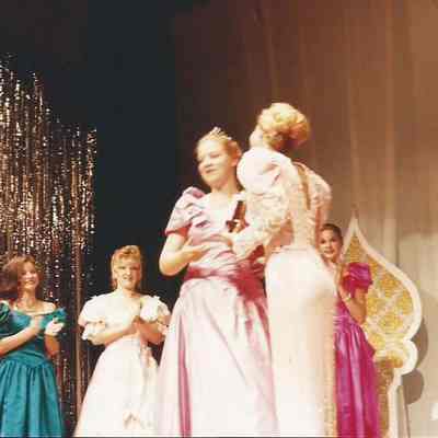 Darby Labbe presenting Lisa Kelly with the Miss Congeniality trophy.