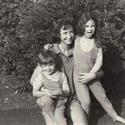 A photo view of a woman with two children. 9/17/1992.