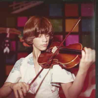 Contestant # 2 Beth Rancourt is playing her violin at dress rehearsal