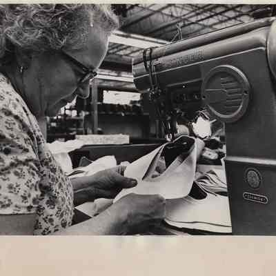 Cecile Pelletier sewing in shoe factory