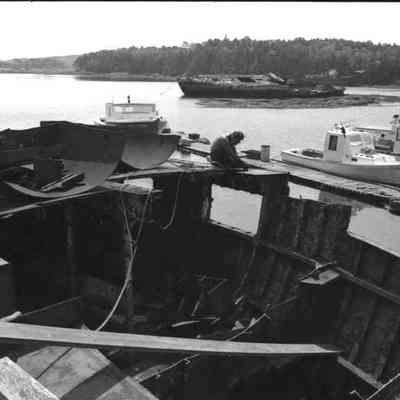 A photo view of dismantling a boat. 11/1/1986.