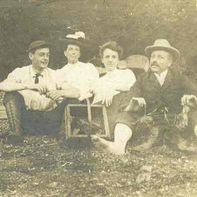 Chester E. Kellogg and others outdoors