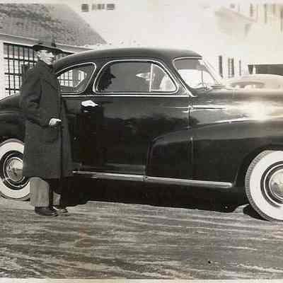 Sumner Holbrook Standing Beside a Car