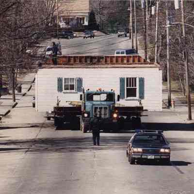 A photo view of moving a house.3/28/1990.