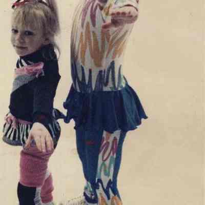 A photo view of 2 little girls dancing. 3/14/1990.