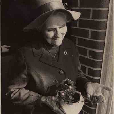 A photo view of Lori Fleming carrying a real shamrock. 3/16/1979