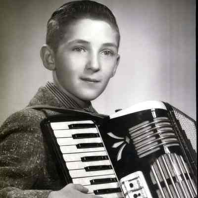 Ron Ouellette posing with his accordion.
