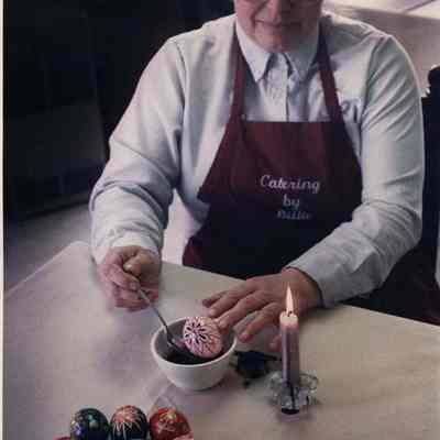 A photo view of a man decorating Easter Eggs. 3/20/1989.