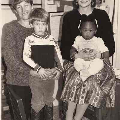 Two unidentified women with two unidentified children.