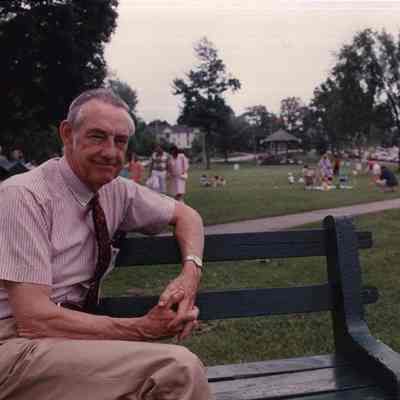 A photo view of a man sitting on a bench at the Mall. 6/22/1989.