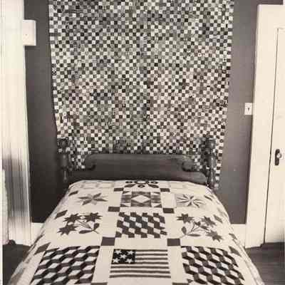 A photo view of quilts on display. 2/14/1992.