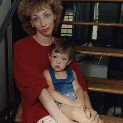 A photo view of a woman and a child. 8/31/1989.