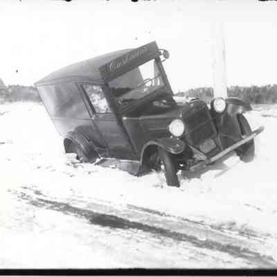 1920s era truck stuck in snow