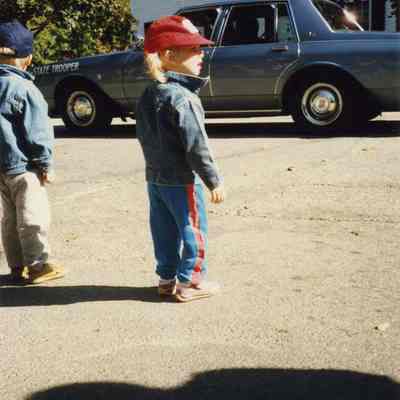 A photo of a spectator watching the 250th parade.10/7/1989.