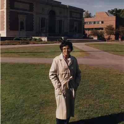 A photo view of a woman in front of the Walker Art Building. 9/28/1990.