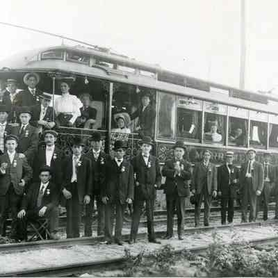 A group of people around the Merrymeeting car.