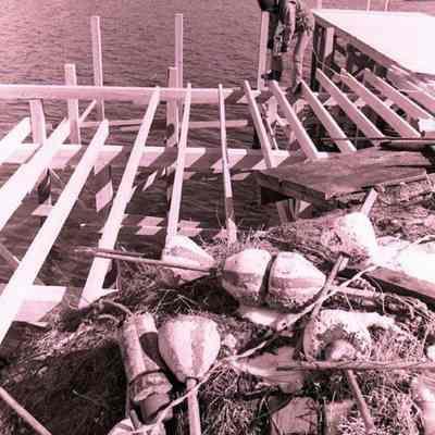 A photo view of a wharf being built at Bailey Island. 3/10/1978.