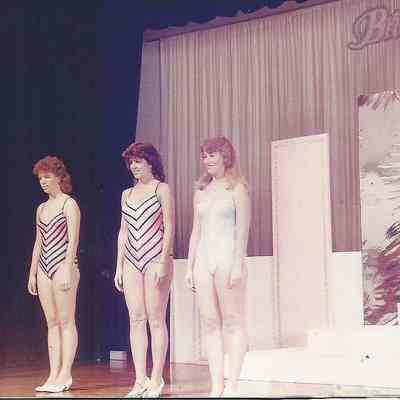 A color photograph of the group judging in Swimsuits