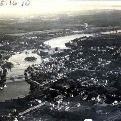 1) aerial view of Androscoggin River at Brunswick/Topsham centers, 2) View of people on bridge over Androscoggin River.
