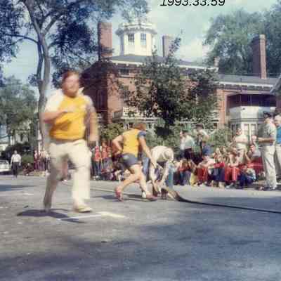 A photo of a man running down Park Row. 9/16/1973.